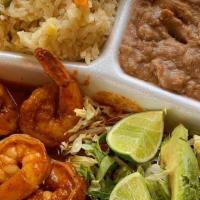Camarones A La Diabla · Shrimp in a la diabla sauce (very hot ) served with white rice, refried beans and salad