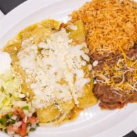 Enchiladas Verdes · Three chicken enchiladas covered in our homemade tomatillo green salsa, topped with queso fr...