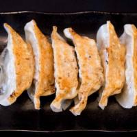 Gyoza (6) · Handmade pan-fried pork dumplings.