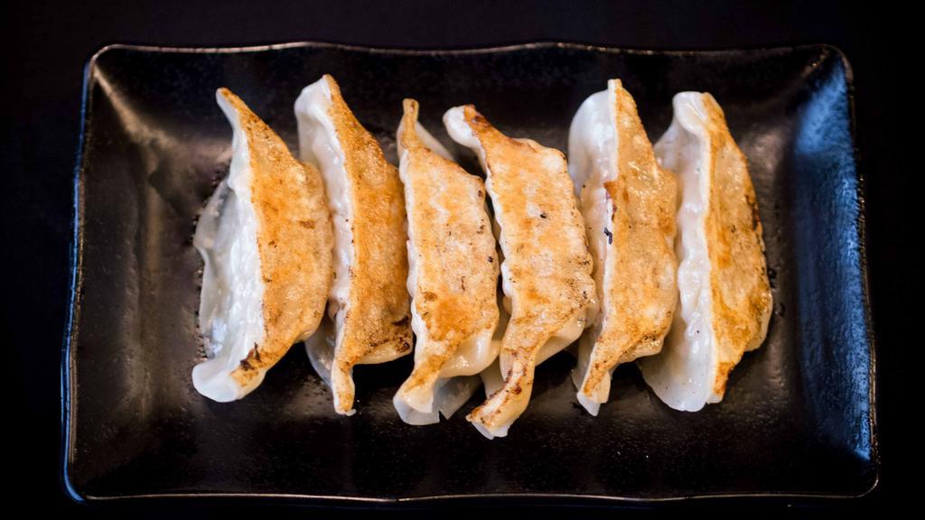 Gyoza (6) · Handmade pan-fried pork dumplings.