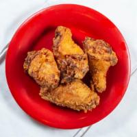 Crispy Chicken Wings (4 Pcs) · Marinated chicken wings lightly battered and fried golden brown.