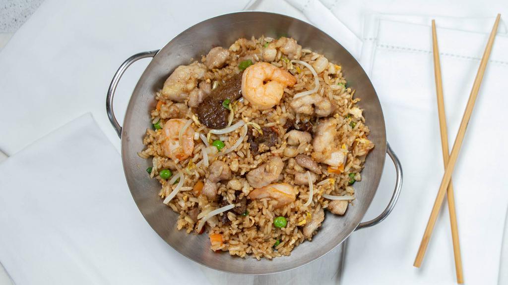 Combo Fried Rice · Fried rice with peas, carrots, onions, bean sprouts, egg, beef, chicken & shrimp.