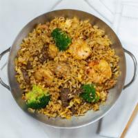 Singapore Fried Rice · Spicy.  Yellow curry fried rice with broccoli,  onions, egg and choice of protein