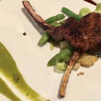 Lamb Chops · two grilled chops. Served with Turkish bulgur rice and bean salad.