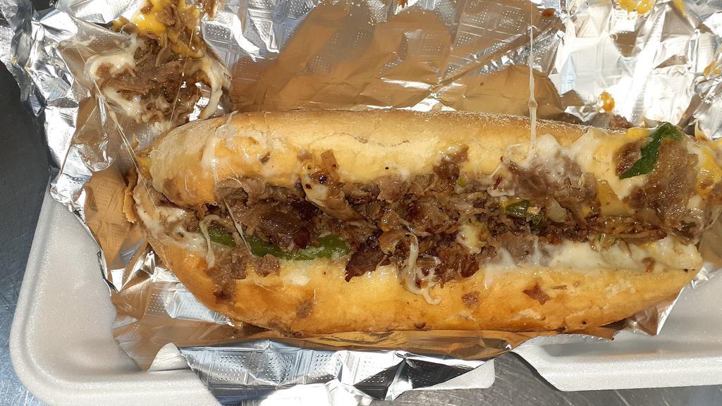 Lil' Phil · Same philly cheesesteak with bell peppers, onions and (optional) mushrooms, only less meat and less cheese. Sliced rib-eye (4 oz. ). And slices of smoked provolone cheese (2) on amoroso's roll.