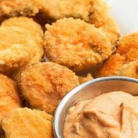 Fried Pickles · Breaded Fried pickles with a kick of spice. Served with Chipotle ranch dipping sauce.