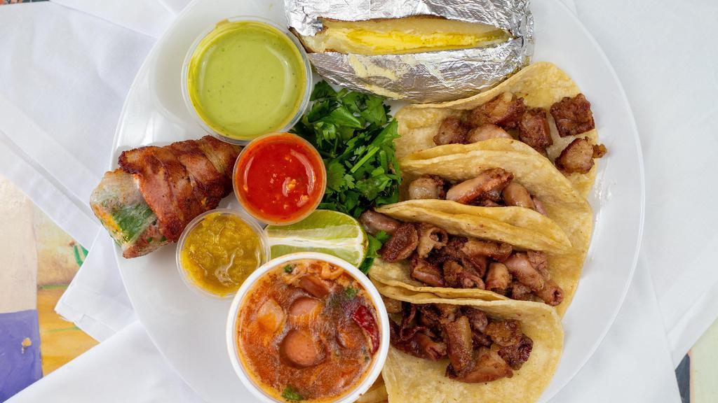 Tacos Tripitas · Taco include an order of 4 tacos, grilled onions, a jalapeño stuffed with cheese and wrapped in bacon, salsa verde, roja, gucamole and pico de gallo.