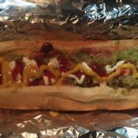 Juarez Hot Dog · Hot dog wrapped in bacon with nacho cheese, beans, tomatoes, fresh onions, relish and mayonn...