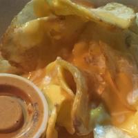 Papas Nachos · Fresh cut potato chips with nacho cheese.