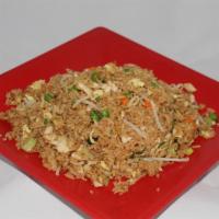 Wok Fried Rice · Stir-fried rice with egg, bean sprouts, green onions, peas and carrots.