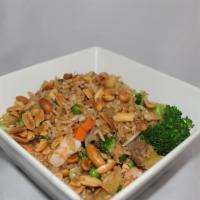 Pineapple Fried Rice · Stir-fried rice with egg, bean sprouts, green onions, peas and carrots, broccoli and pineapp...
