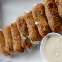 Fried Mozzarella Bites · Hand cut and battered. Served with house made ranch for dipping.