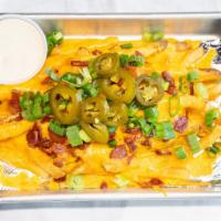 Side Of Loaded Fries · Side order of fries smothered in cheddar cheese, hickory smoked bacon, pickled jalapeno and ...