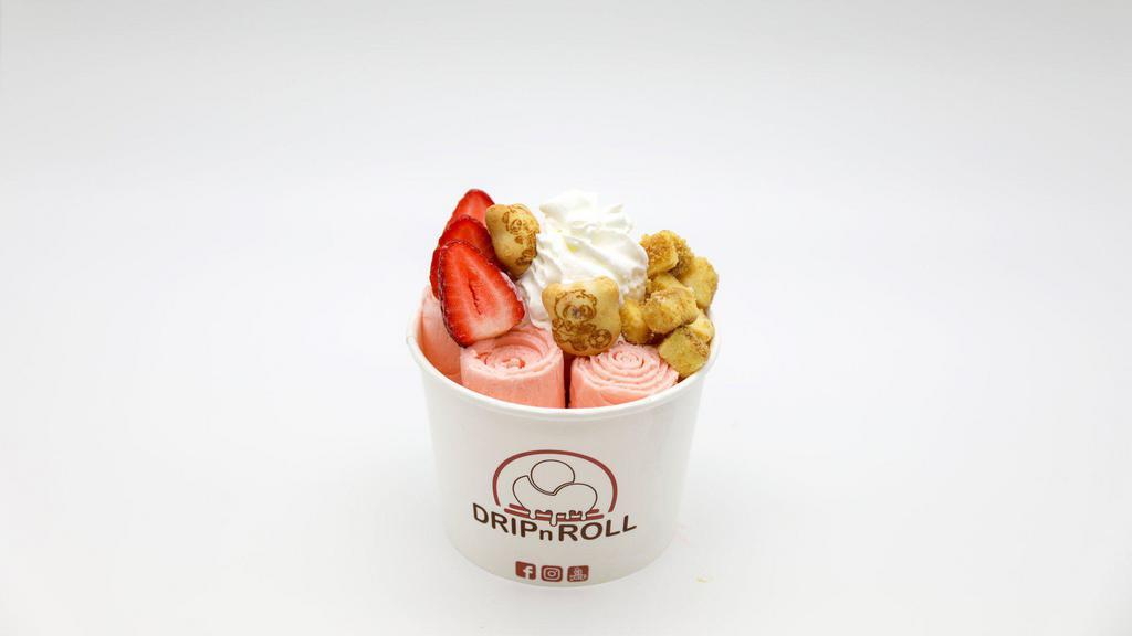 Strawberry Cheesecake · Strawberry ice cream mix with cheesecake pieces, topped with whipped, cheesecake pieces, strawberry and panda bear cookies.
