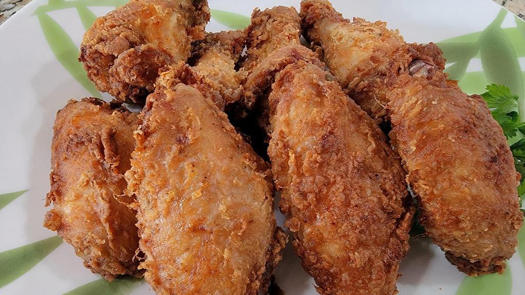 Tasty Chicken Wings · Chicken Wings is specially marinated, and fried to crisp. Served with your favorite choice of seasoning. (8 pieces)