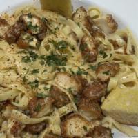 Shrimp Alfredo Pasta · Perfectly cooked pasta in a creamy Cajun-style alfredo. Served with hot garlic French bread.