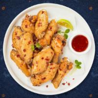 Thai Chicken Wings · (6 pieces) Fresh chicken wings breaded and fried until golden brown. Served with Thai sweet ...