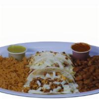 Taco Plate · Three tacos served with a side of French fries or rice and beans.