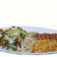 Taco Plate · Three tacos with side of rice and beans.