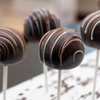 3X Chocolate Fudge · A triple chocolate fudge cake pop coated in plain chocolate and finished with white and milk...