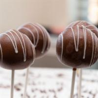 Milk Chocolate · A decadent milk chocolate cake pop coated in milk chocolate and finished with a white chocol...
