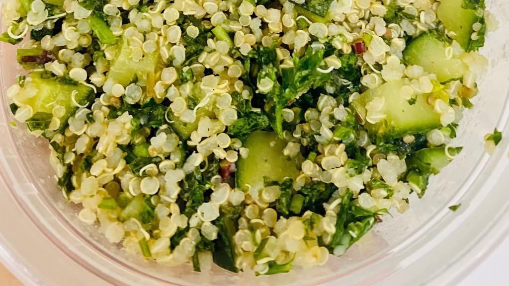 Quinoa Tabbouleh · Filling keto salad traditional mediterranean flavors. Quinoa, cucumbers, parsley, mint, pink salt, lemons, olive oil, and black pepper.