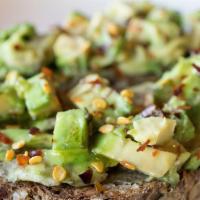 Avocado Toast · Ezekiel seed and grain bread  with organic avocado, red chili flakes, organic Extra Virgin o...