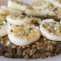 Almond Butter Toast · Whole Grain bread with organic almond butter, organic banana, organic hemp seeds, and maple ...