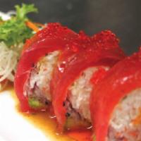 Red Roll · Raw. In: crab meat, avocado, red onion and wrapped in soy paper. Out: tuna, goma sauce, tobi...