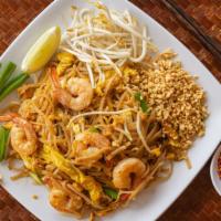 Pad Thai · Stir-fried rice noodles with egg, bean sprout and green onion .Garnished with lime and crush...