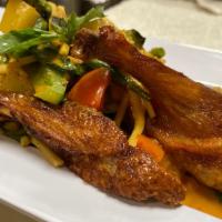 Gaeng Phet Ped Yang ( Red Curry Roasted Duck ) · Roasted duck covered with red curry sauce cooked with bamboo shoots, pineapple, bell peppers...
