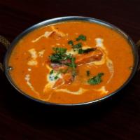 Butter Chicken · Boneless dark chicken roasted in a clay oven & then cooked in a creamy tomato sauce