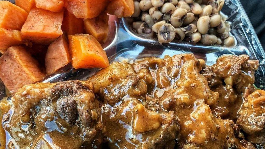 World Famous Oxtails · Our meaty, seasoned to perfection, and cooked to precise tenderness oxtails are voted #1 in the city. Served with rice and choice of 2 sides.