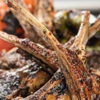 Herb And Rosemary Lamb Chops · 3 seasoned and grilled to perfection lamb chops, served with rice, and choice of 2 sides.