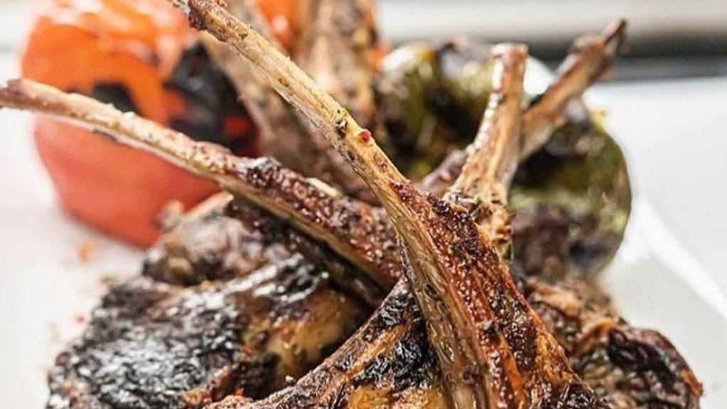 Herb And Rosemary Lamb Chops · 3 seasoned and grilled to perfection lamb chops, served with rice, and choice of 2 sides.