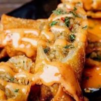 Boudin Eggrolls (3) · 3 Ct. deep-fried boudin rice with pepper jack cheese and served with secret TGS sauce.