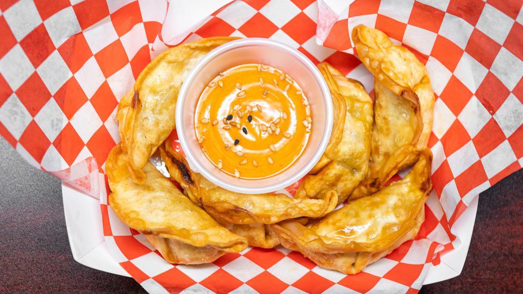 Gyoza · Aka pot stickers. Six pieces of chicken and vegetable dumplings with our specialty house cream sauce.