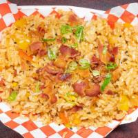 Bacon Kimchi Fried Rice · Savory bell peppers, corn, onion, and kimchi with seasoned fried rice and topped with bits o...