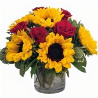 Sunny Days Deluxe · This arrangement is a summer classic! Farm fresh sunflowers and red roses elegantly arranged...
