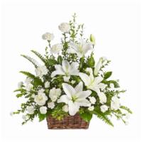 Peaceful White Lilies Basket - Standard · Whether you send this beautiful arrangement to the family home or to the service, all will a...
