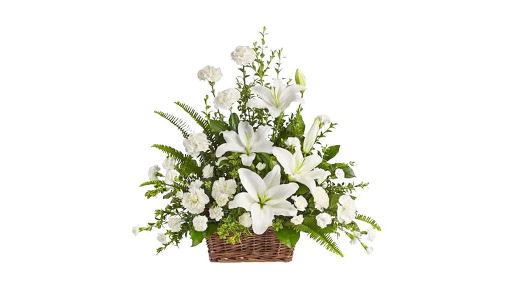 Peaceful White Lilies Basket - Standard · Whether you send this beautiful arrangement to the family home or to the service, all will appreciate its elegance and grace. The contrast of brilliant white blossoms and dazzling greenery create a wonderfully calm and dignified setting.
Gorgeous flowers such as white lilies, carnations and miniature carnations mix with vibrant greens in a large basket. Simply stunning. Approximately 26
