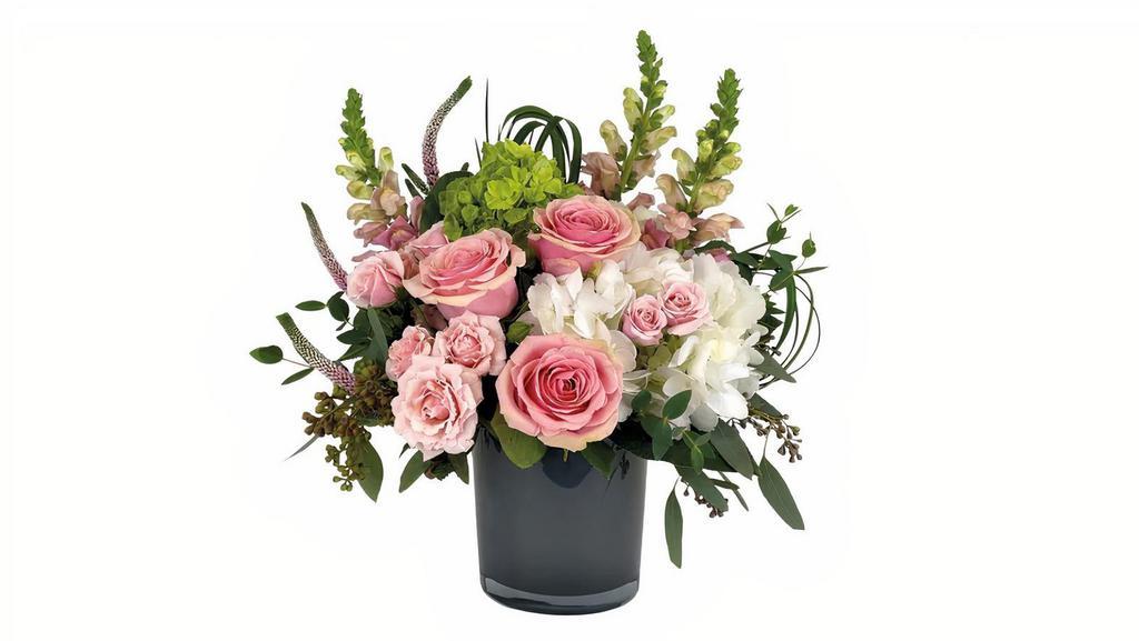 Soft Touch · Everything about this floral arrangement is soft and calming. Soft pink and white flowers are designed in a beautiful dark gray glass cylinder vase.

Approx. 14