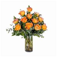 Dozen Free Spirit Roses · One dozen standard orangey-pink Free Spirit roses beautifully arranged in a clear cylinder v...