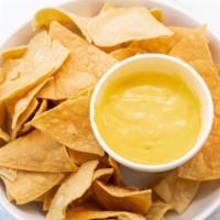 Queso Dip (8 Oz) · Our queso with fresh homemade chips.