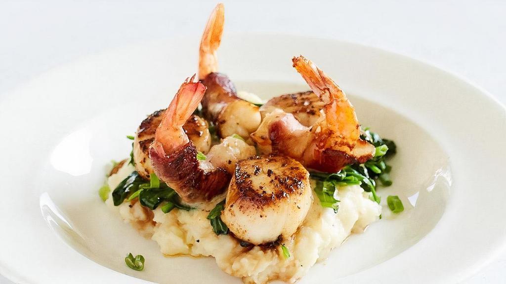 Seared Georges Bank Scallops & Applewood Bacon Wrapped Shrimp · Old Bay beurre blanc, garlic wilted spinach, mashed potatoes