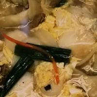 Dumplings Soup · A tofu soup with  vegetable  dumplings