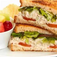 Chicken Salad Sandwich · Served with mixed lettuce and tomato on toasted wheat bread served with chips.