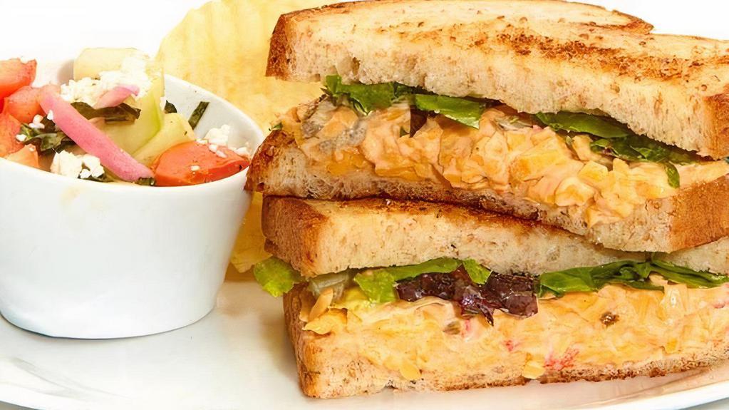 Spicy Pimento Cheese Sandwich · With mixed lettuce on toasted buttermilk bread. Served with chips and choice of a side.