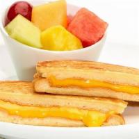 Kid'S Grilled Cheese · American cheese on toasted bread. Includes fresh-cut fruit or chips