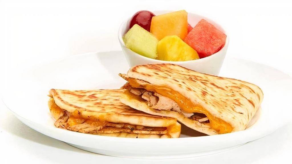 Kid'S Turkey Melt · Seasoned grilled turkey and cheddar on griddled pita served with your choice of chips or fruit